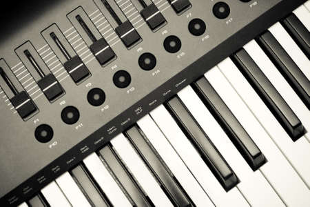 Music Synthesizer closeup. keyboard and controls.