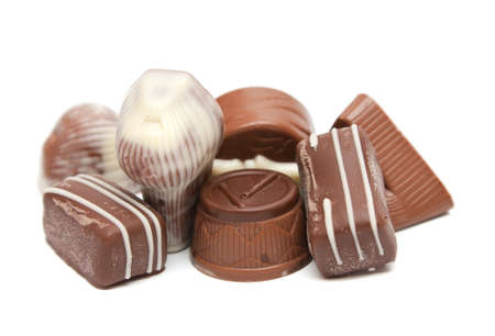 Mixed Chocolates heap against a white background. Delicious chocolate pralinesの写真素材