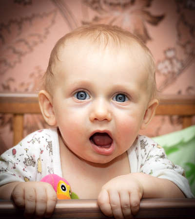 Portrait of a baby with a amusing expression (screaming baby)