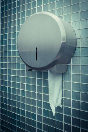 roll of toilet paper in the iron holderの写真素材