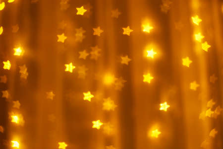 defocused golden lights in the shape of stars