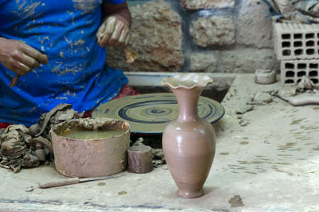 potter shows a ready vase