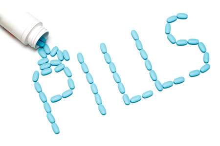 word "pills" from tablets on whiteの写真素材