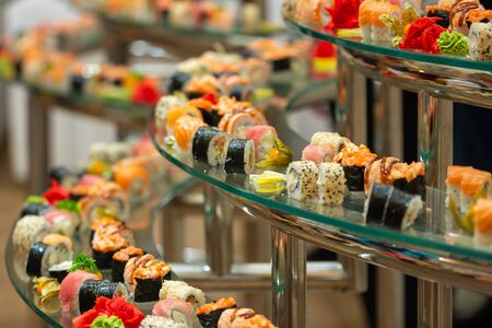 Fresh sushi rolls with great variety. Selective focus on middle . catering.の写真素材