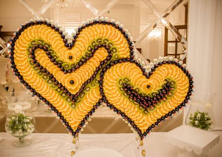 Beautiful assorted fruit in the shape of a heart.の写真素材