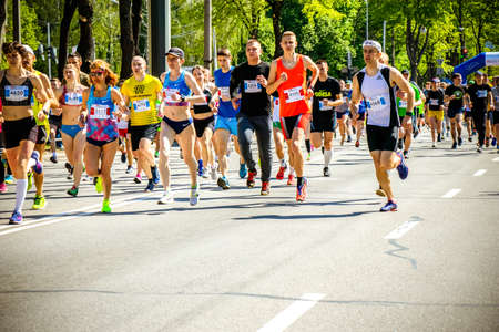 Ukraine, Vinnitsa, June 1, 2019. Khmelnitsky highway.Marathon running race people competing in fitness and healthy active lifestyle feet on roadのeditorial素材