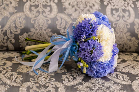 Beautiful wedding bouquet on the couchの写真素材