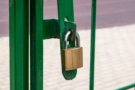 new golden lock on the green gate