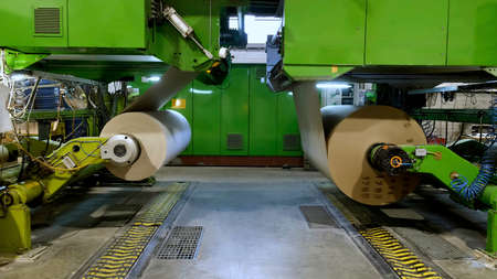 Manufacture of corrugated paper and containers of paper and paperboard. Large rolls of paper. The gap of paper.の写真素材