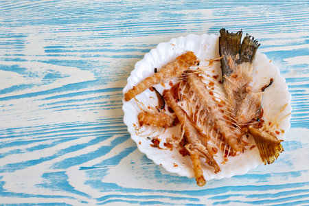 This is an image of a plate with what appears to be a type of seafood possibly a type or variety of fish or shellfishの写真素材