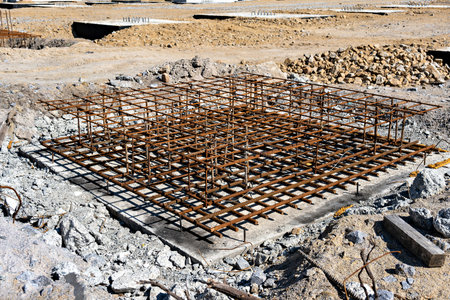 This image shows a construction site with a large open excavation areaの写真素材