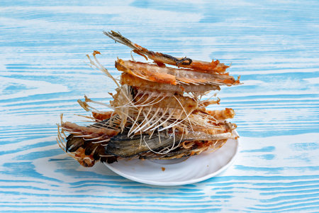 This image shows a plate with what appears to be a pile of seafood possibly a type of fish or...