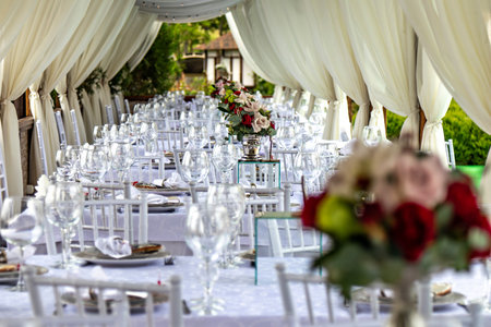 This image shows a beautifully set up table for a formal event such as a wedding reception or a gala...