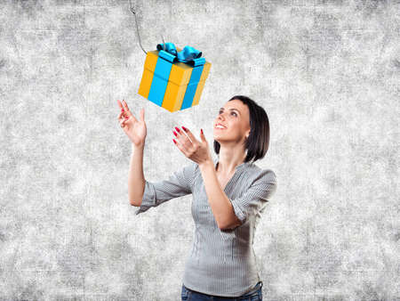Girl looks at a beautiful gift with a hook