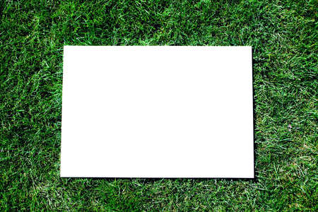 Photo of a announcement board on a green grassの写真素材