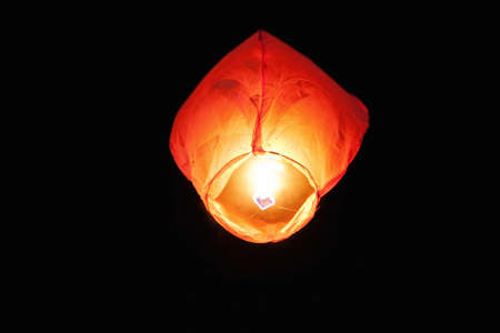 Photo of a burning big heavenly lantern at night