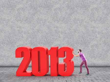 The man pushes old year on replacement of the newの写真素材