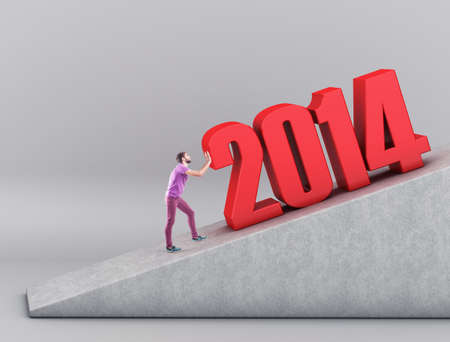 The person pushes new year upwards on mountainの写真素材