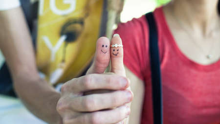 Photo of two fingers of a loving coupleの写真素材