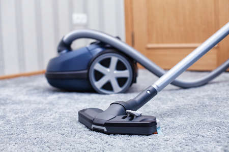 The new vacuum cleaner lies in a roomの写真素材