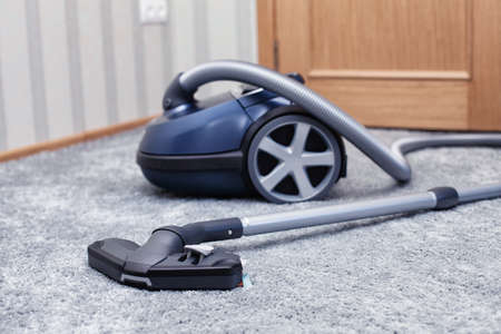 The new vacuum cleaner lies in a roomの写真素材