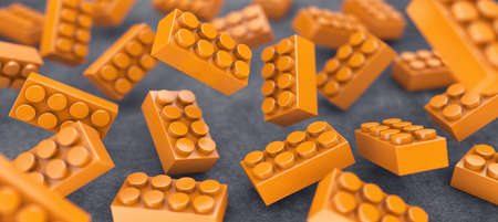 Many orange constructor chaotically flying in airの写真素材