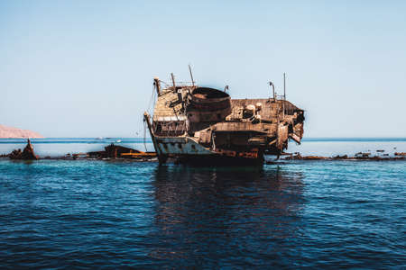 Photo of the old and rusty sunk shipの写真素材