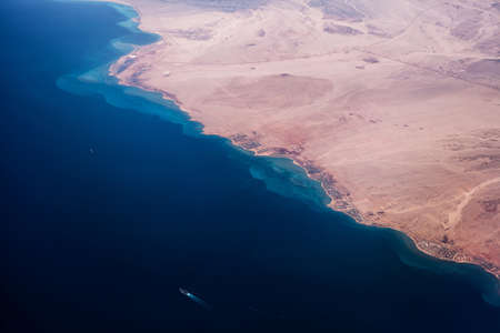 Photo of desert with sea and hot climate