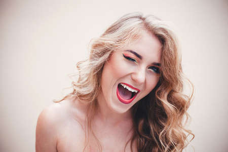 Beautiful girl with a colorful makeup and nice hairstyleの写真素材