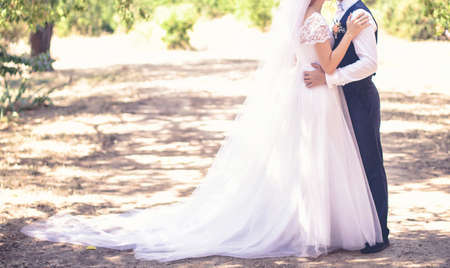 Young pair in strong embraces in the wedding dayの写真素材