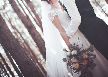 Young pair in strong embraces in the wedding dayの写真素材