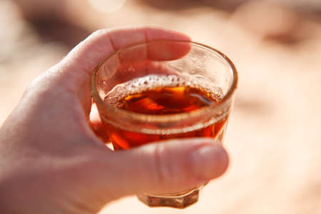 Fruity fragrant tea in a transparent glass