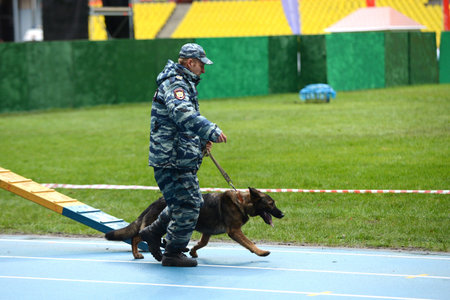 Cynologists with dogs in Moscow.のeditorial素材