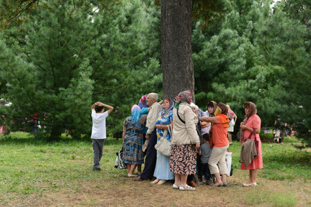 Pilgrims at healing cedar. Vvedensky Tolga convent.のeditorial素材