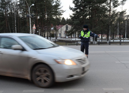 The inspector of traffic police stops the car.のeditorial素材