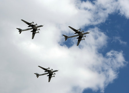 The group of Soviet strategic bomber Tupolev Tu-95 "Bear" flies over Red Squareのeditorial素材
