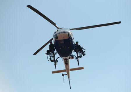 SWAT fighters on a police helicopter AS-355