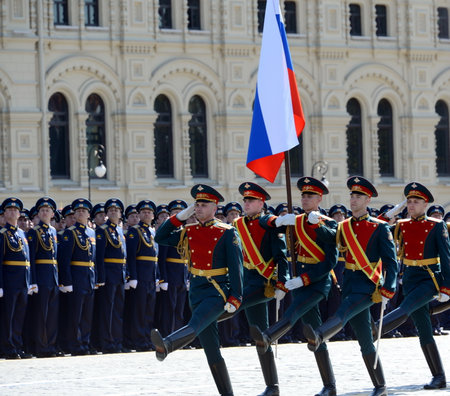 Soldiers of the honor guard special commandant of the Preobrazhensky regiment carry the Russian flag...