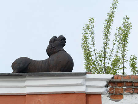 A lion over an arch leading to the courtyard of the merchants' house Morozov on the Socialist Avenue in Barnaul.の写真素材