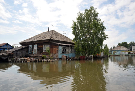 Flood. The river Ob, which emerged from the shores, flooded the outskirts of the city.のeditorial素材