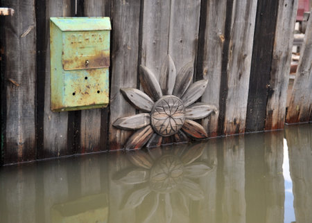 Mailbox during the flood. The river Ob, which emerged from the shores, flooded the outskirts of the city.のeditorial素材