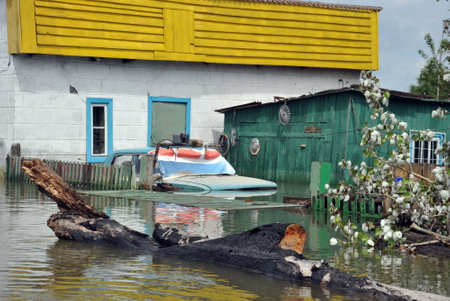 Flooded car. The river Ob, which emerged from the shores, flooded the outskirts of the city.のeditorial素材