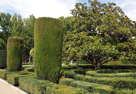 Plaza de Oriente Central Gardens with Monument to Philip IV located between the Royal Palace and the Royal Theater in Madrid.のeditorial素材