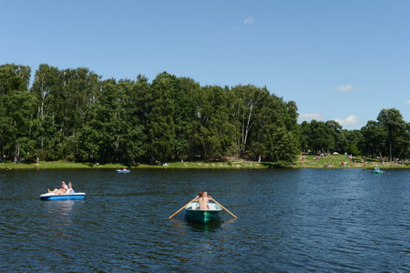 People go boating in the natural-historical park Kuzminki-Lublino.