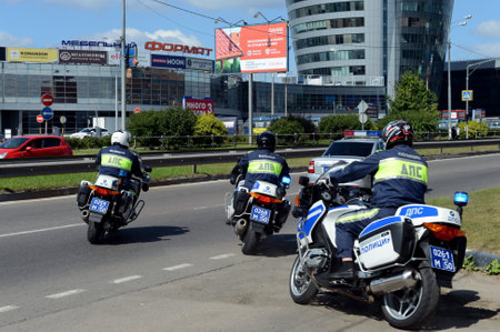 Inspectors of traffic police on motorcycles go on patrolling roads.のeditorial素材