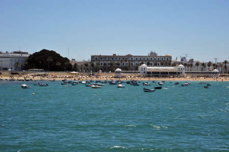 Boats off the coast near the beach of La Catalina in Cadiz.の写真素材