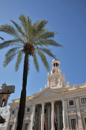 Old city hall in Cadiz, Spain. Clock tower on blue sky backgroundのeditorial素材