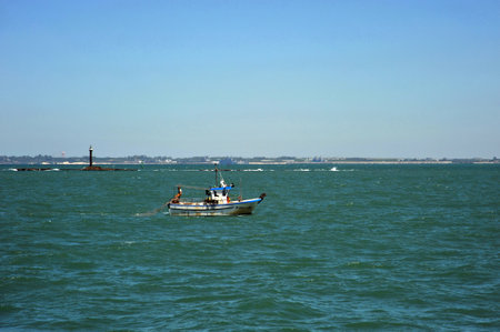 Fishing boat off the coast of the sea town of Cadiz.のeditorial素材