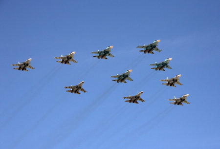 Tactical wing in the group of fighters SU-34, SU-30SM and SU-35 fly during the parade in the sky...