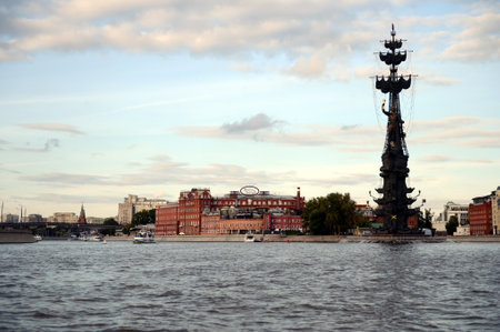 A view of the building of the factory "Red October" and a monument to Peter the Great in the center of Moscow.のeditorial素材